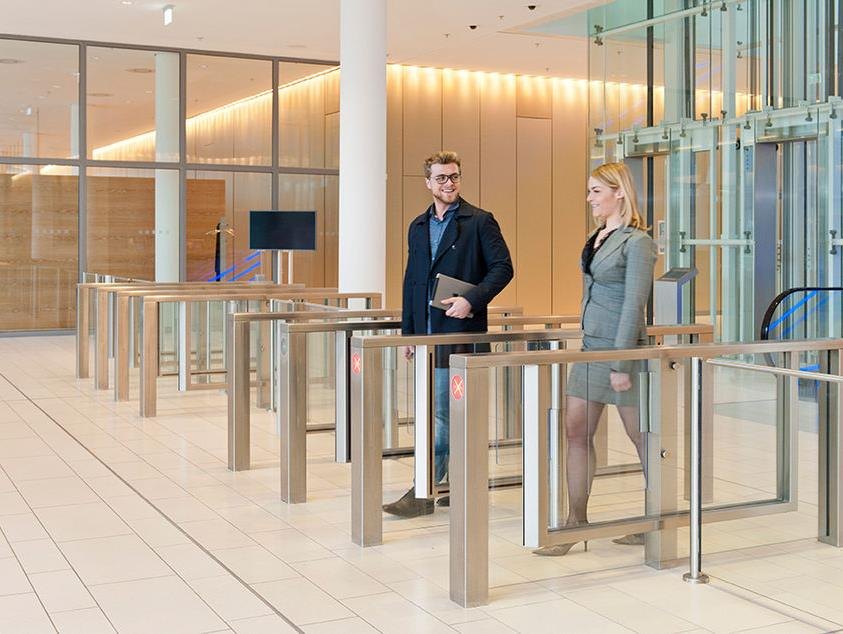 Turnstile access control installation in a building lobby